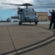A MH-60S Seahawk helicopter prepares to evacuate Naval Air Station Norfolk.